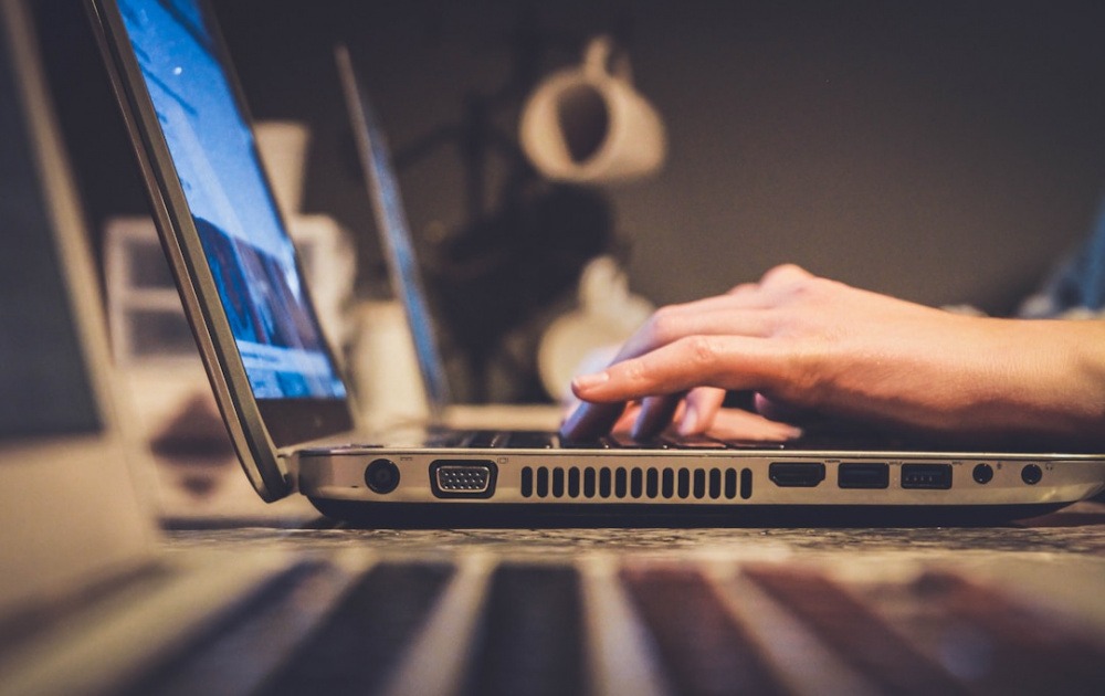 Email marketing manager using email capture best practices on laptop